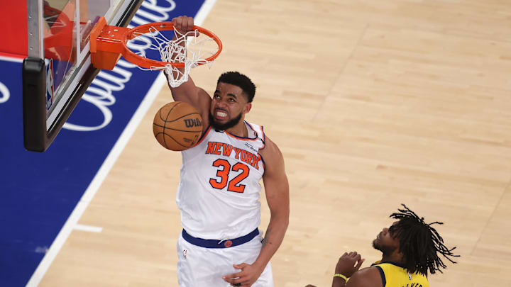 May 29, 2025; New York, New York, USA; New York Knicks center Karl-Anthony Towns (32) dunks against Indiana Pacers forward Jarace Walker (5) in the fourth quarter during game five of the eastern conference finals for the 2025 NBA Playoffs at Madison Square Garden. Mandatory Credit: Brad Penner-Imagn Images
