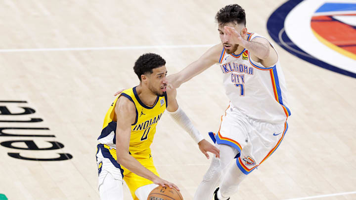 Jun 16, 2025; Oklahoma City, Oklahoma, USA; Indiana Pacers guard Tyrese Haliburton (0) drives to the basket past Oklahoma City Thunder forward Chet Holmgren (7) during the fourth quarter in game five of the 2025 NBA Finals at Paycom Center. Mandatory Credit: Alonzo Adams-Imagn Images