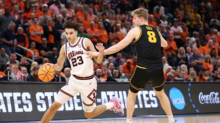 Mar 28, 2026; Houston, TX, USA; Illinois Fighting Illini guard Keaton Wagler (23) controls the ball against Iowa Hawkeyes forward Cooper Koch (8) in the first half during an Elite Eight game of the South Regional of the men's 2026 NCAA Tournament at Toyota Center. Mandatory Credit: Troy Taormina-Imagn Images
