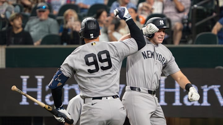 New York Yankees first baseman Ben Rice (22) bumps elbows with right fielder Aaron Judge (99) after hitting two-run home run against the Texas Rangers during the third inning at Globe Life Field.