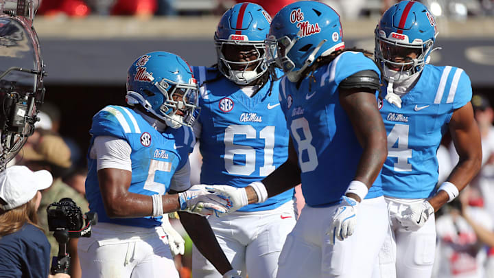 Sep 27, 2025; Oxford, Mississippi, USA; Mississippi Rebels running back Kewan Lacy (5) and tight end Dae'Quan Wright (8) react after a touchdown during the second quarter against the LSU Tigers at Vaught-Hemingway Stadium. Mandatory Credit: Petre Thomas-Imagn Images