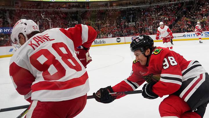 Nov 6, 2024; Chicago, Illinois, USA; Chicago Blackhawks center Connor Bedard (98) and Detroit Red Wings right wing Patrick Kane (88) go for the puck during the first period at United Center. Mandatory Credit: David Banks-Imagn Images