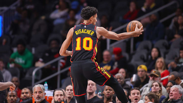 Mar 6, 2025; Atlanta, Georgia, USA; Atlanta Hawks forward Zaccharie Risacher (10) attempts to save a ball going out of bounds against the Indiana Pacers in the first quarter at State Farm Arena. Mandatory Credit: Brett Davis-Imagn Images