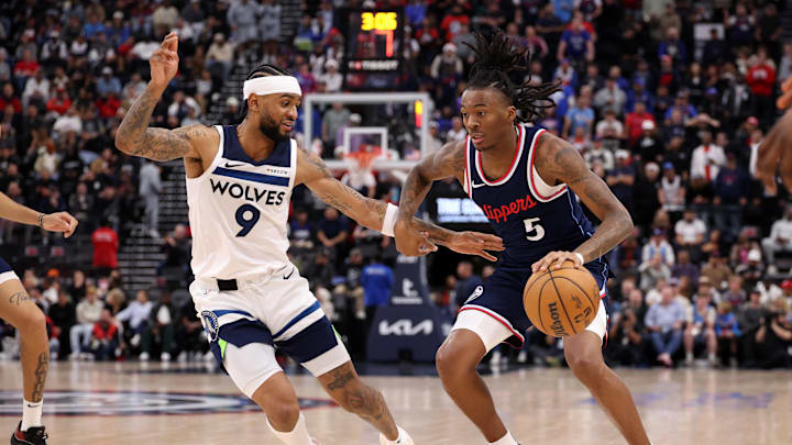 Dec 4, 2024; Inglewood, California, USA; Los Angeles Clippers guard Bones Hyland (5) dribbles against Minnesota Timberwolves guard Nickeil Alexander-Walker (9) during the third quarter at Intuit Dome. Mandatory Credit: Kiyoshi Mio-Imagn Images Dec 4, 2024; Inglewood, California, USA; Los Angeles Clippers guard Bones Hyland (5) dribbles against Minnesota Timberwolves guard Nickeil Alexander-Walker (9) during the third quarter at Intuit Dome. Mandatory Credit: Kiyoshi Mio-Imagn Images