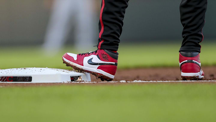 Apr 19, 2024; Cincinnati, Ohio, USA; A detail view of the cleats of Cincinnati Reds shortstop Elly De La Cruz (44) as he stands on first base in the second inning against the Los Angeles Angels at Great American Ball Park. Mandatory Credit: Katie Stratman-Imagn Images