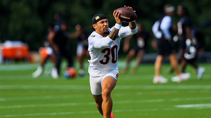 Cincinnati Bengals running back Chase Brown (30) catches a pass during training camp at Kettering Health Practice Fields. Cincinnati Bengals running back Chase Brown (30) catches a pass during training camp at Kettering Health Practice Fields.