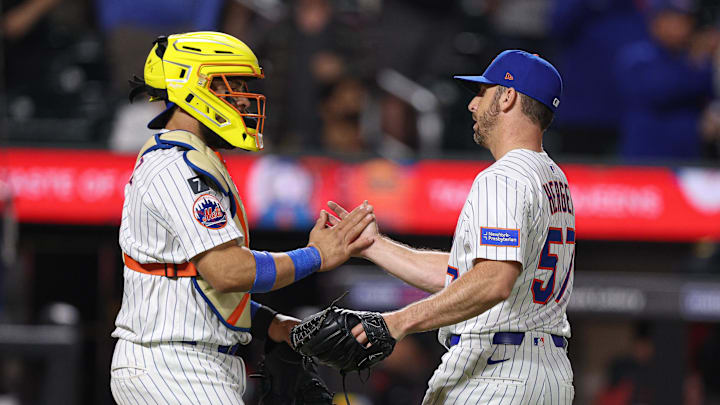 Apr 29, 2025; New York City, New York, USA; New York Mets relief pitcher Kevin Herget (57) celebrates with New York Mets catcher Francisco Alvarez (4) after defeating the Arizona Diamondbacks at Citi Field. Mandatory Credit: Vincent Carchietta-Imagn Images