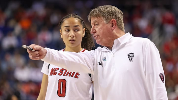 Mar 9, 2025; Greensboro, NC, USA; NC State Wolfpack head coach Wes Moore talks with NC State Wolfpack guard Devyn Quigley (0) during the fourth quarter against Duke Blue Devils at First Horizon Coliseum. Mandatory Credit: Cory Knowlton-Imagn Images Mar 9, 2025; Greensboro, NC, USA; NC State Wolfpack head coach Wes Moore talks with NC State Wolfpack guard Devyn Quigley (0) during the fourth quarter against Duke Blue Devils at First Horizon Coliseum. Mandatory Credit: Cory Knowlton-Imagn Images