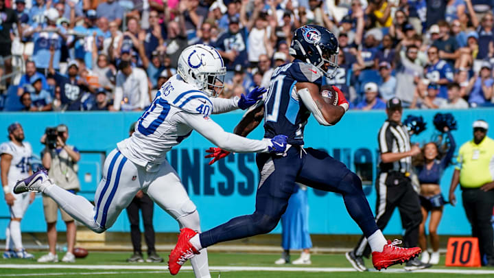 Tennessee Titans running back Tony Pollard (20) scores a touchdown past Indianapolis Colts cornerback Jaylon Jones (40) during the third quarter at Nissan Stadium in Nashville, Tenn., Sunday, Oct. 13, 2024.
