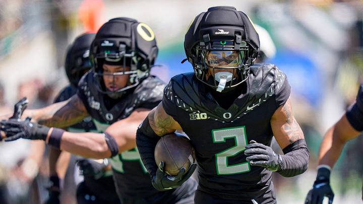 Combat Ducks cornerback Na'eem Offord carries the ball during the Oregon Ducks annual spring game on April 25, 2026 at Autzen Stadium in Eugene, Oregon.