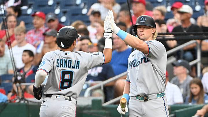 Miami Marlins right fielder Javier Sanoja congratulated by first baseman Kyle Stowers Mandatory Credit: Brad Mills-Imagn Images