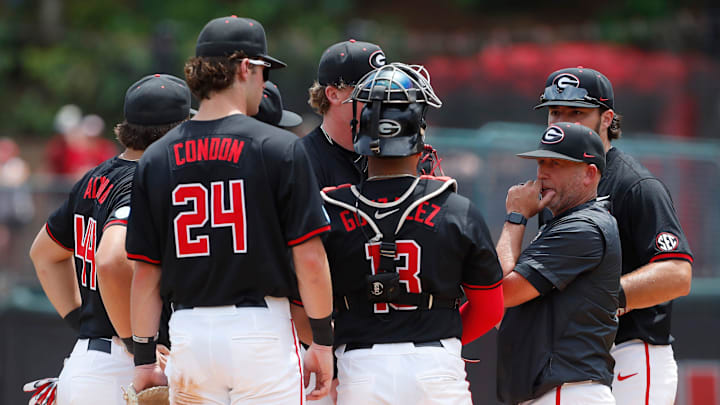 Georgia baseball coach Wes Johnson huddles up his team during a NCAA Athens Regional baseball game against Army in Athens, Ga., on Friday, May 31, 2024.