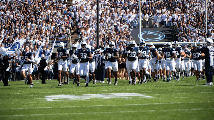 The Penn State Nittany Lions run onto the field at Beaver Stadium for their season-opener vs. the Nevada Wolf Pack. The Penn State Nittany Lions run onto the field at Beaver Stadium for their season-opener vs. the Nevada Wolf Pack.