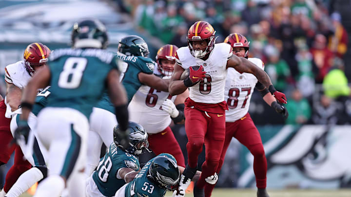 Jan 26, 2025; Philadelphia, PA, USA; Washington Commanders running back Brian Robinson Jr. (8) runs with the ball against the Philadelphia Eagles during the first half in the NFC Championship game at Lincoln Financial Field. Mandatory Credit: Bill Streicher-Imagn Images