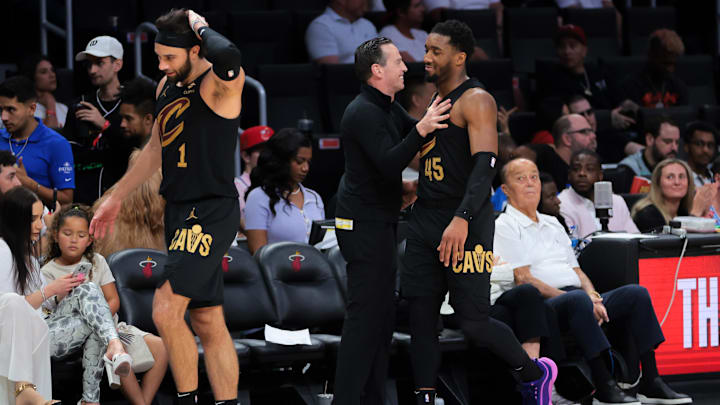 Apr 26, 2025; Miami, Florida, USA; Cleveland Cavaliers guard Donovan Mitchell (45) celebrates with head coach Kenny Atkinson in the fourth quarter against the Miami Heat during game three for the first round of the 2025 NBA Playoffs at Kaseya Center. Mandatory Credit: Sam Navarro-Imagn Images Apr 26, 2025; Miami, Florida, USA; Cleveland Cavaliers guard Donovan Mitchell (45) celebrates with head coach Kenny Atkinson in the fourth quarter against the Miami Heat during game three for the first round of the 2025 NBA Playoffs at Kaseya Center. Mandatory Credit: Sam Navarro-Imagn Images