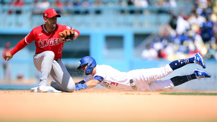 Aug 8, 2021; Los Angeles, California, USA; Los Angeles Dodgers center fielder Chris Taylor (3) steals second against Los Angeles Angels shortstop Jose Iglesias (4) during the fifth inning at Dodger Stadium. Mandatory Credit: Gary A. Vasquez-Imagn Images Aug 8, 2021; Los Angeles, California, USA; Los Angeles Dodgers center fielder Chris Taylor (3) steals second against Los Angeles Angels shortstop Jose Iglesias (4) during the fifth inning at Dodger Stadium. Mandatory Credit: Gary A. Vasquez-Imagn Images