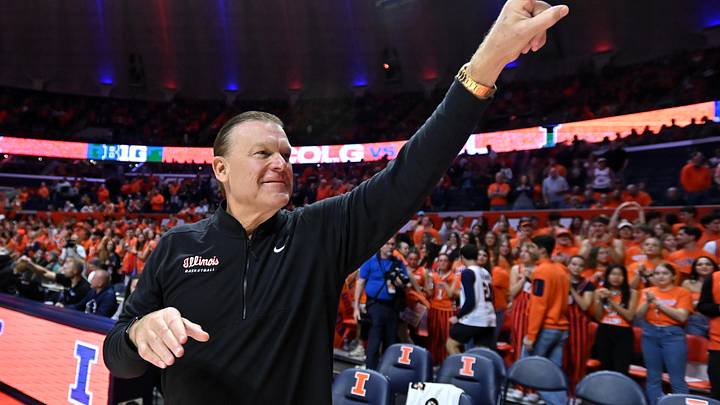 Nov 14, 2025; Champaign, Illinois, USA;  Illinois Fighting Illini head coach Brad Underwood greets the crowd before the tip of the game with the Colgate Raiders  at State Farm Center. Mandatory Credit: Ron Johnson-Imagn Images
