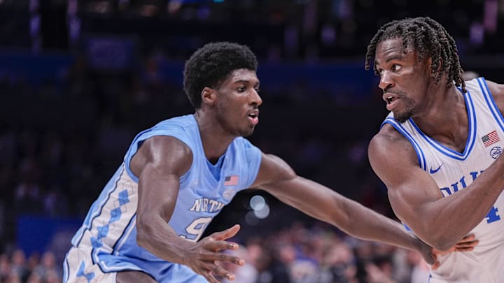 Mar 14, 2025; Charlotte, NC, USA; Duke Blue Devils guard Sion James (14) handles the ball against North Carolina Tar Heels guard Drake Powell (9) during the second half at Spectrum Center. Mandatory Credit: Jim Dedmon-Imagn Images Mar 14, 2025; Charlotte, NC, USA; Duke Blue Devils guard Sion James (14) handles the ball against North Carolina Tar Heels guard Drake Powell (9) during the second half at Spectrum Center. Mandatory Credit: Jim Dedmon-Imagn Images