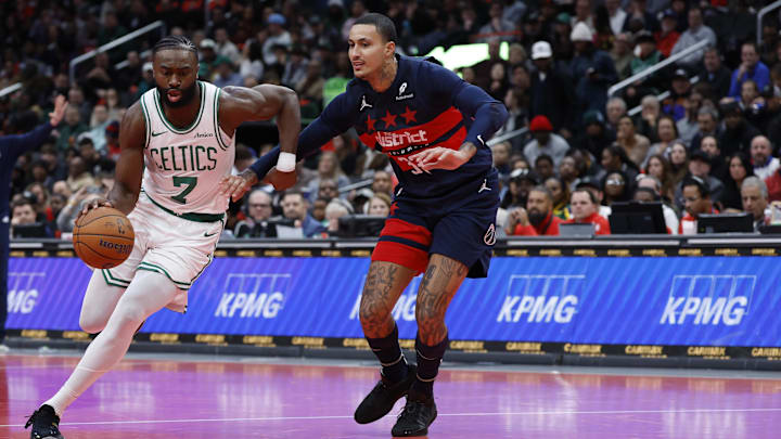 Nov 22, 2024; Washington, District of Columbia, USA; Boston Celtics guard Jaylen Brown (7) drives to the basket past Washington Wizards forward Kyle Kuzma (33) in the first half at Capital One Arena. Mandatory Credit: Geoff Burke-Imagn Images