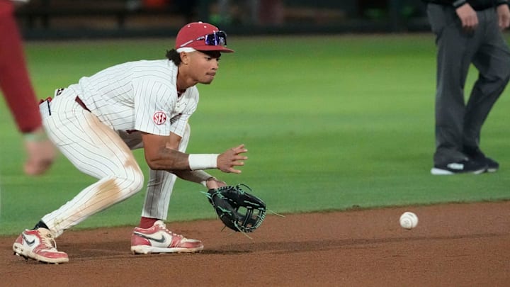 Alabama shortstop Justin Lebron fields a ground ball and throws to first for an out during the game with Auburn at Sewell-Thomas Stadium. Alabama shortstop Justin Lebron fields a ground ball and throws to first for an out during the game with Auburn at Sewell-Thomas Stadium.