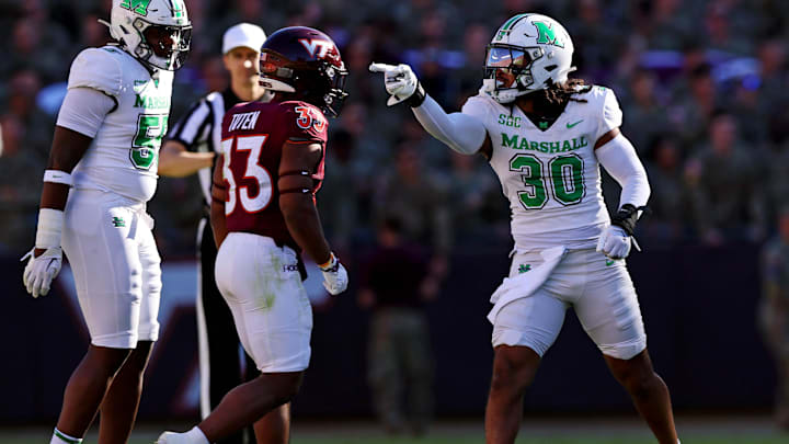 Sep 7, 2024; Blacksburg, Virginia, USA; Marshall Thundering Herd linebacker Jaden Yates (30) celebrates after a play during the first quarter against the Virginia Tech Hokies at Lane Stadium. Mandatory Credit: Peter Casey-Imagn Images Sep 7, 2024; Blacksburg, Virginia, USA; Marshall Thundering Herd linebacker Jaden Yates (30) celebrates after a play during the first quarter against the Virginia Tech Hokies at Lane Stadium. Mandatory Credit: Peter Casey-Imagn Images