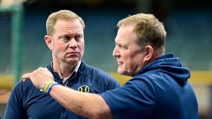 Oct 2, 2024; Milwaukee, Wisconsin, USA; Milwaukee Brewers general manager Matt Arnold talks to manager Matt Arnold before game two of the Wildcard round for the 2024 MLB Playoffs against the New York Mets at American Family Field. Mandatory Credit: Benny Sieu-Imagn Images