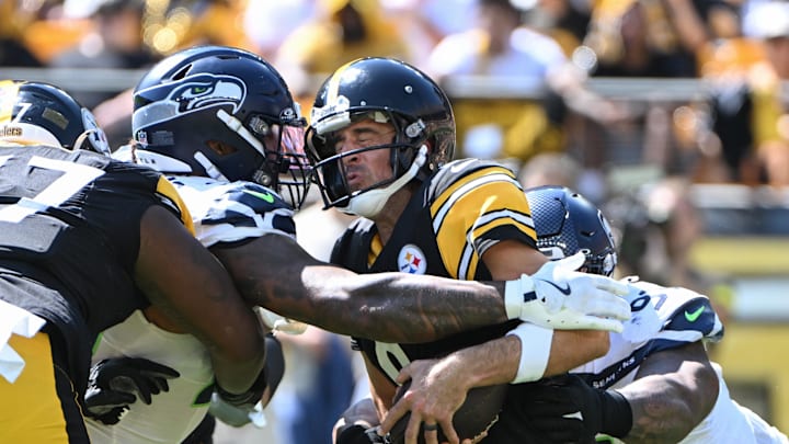Sep 14, 2025; Pittsburgh, Pennsylvania, USA; Seattle Seahawks defensive end Leonard Williams (99) and defensive tackle Byron Murphy II (91) sack Pittsburgh Steelers quarterback Aaron Rodgers (8) during the second quarter at Acrisure Stadium. Mandatory Credit: Barry Reeger-Imagn Images