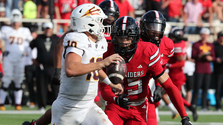 Sep 21, 2024; Lubbock, Texas, USA;  Texas Tech Red Raiders defensive back Miquel Dingle Jr. (35) pressures Arizona State Sun Devils quarterback Sam Leavitt (10) in the second half at Jones AT&T Stadium and Cody Campbell Field. Mandatory Credit: Michael C. Johnson-Imagn Images