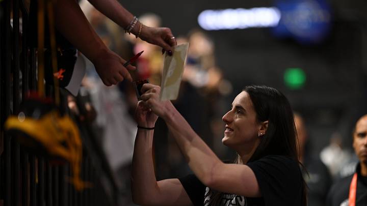 Sep 7, 2025; Washington, Baltimore, MD, USA; Indiana Fever guard Caitlin Clark (22) signs autographs for fans before a game between the Washington Mystics and the Indiana Fever at CFG Bank Arena. Mandatory Credit: Rafael Suanes-Imagn Images