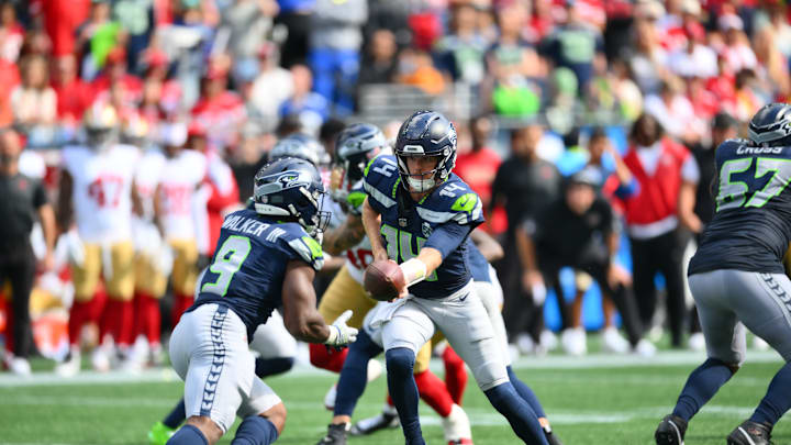 Sep 7, 2025; Seattle, Washington, USA; Seattle Seahawks quarterback Sam Darnold (14) hands the ball off to Seattle Seahawks running back Kenneth Walker III (9) during the second half at Lumen Field. Sep 7, 2025; Seattle, Washington, USA; Seattle Seahawks quarterback Sam Darnold (14) hands the ball off to Seattle Seahawks running back Kenneth Walker III (9) during the second half at Lumen Field.
