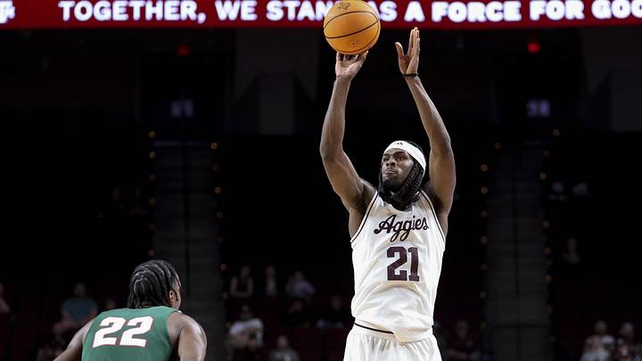 Nov 25, 2025; College Station, Texas, USA; Texas A&M Aggies forward Mackenzie Mgbako (21) attempts a three point basket during the first half against the Mississippi Valley State Delta Devils at Reed Arena. Mandatory Credit: Maria Lysaker-Imagn Images 