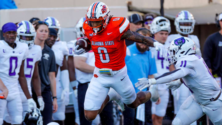 Sep 2, 2023; Stillwater, Oklahoma, USA; Oklahoma State's Ollie Gordon II (0) runs the ball against Central Arkansas in the first quarter at Boone Pickens Stadium. Mandatory Credit: Nathan J. Fish-USA TODAY Sports Sep 2, 2023; Stillwater, Oklahoma, USA; Oklahoma State's Ollie Gordon II (0) runs the ball against Central Arkansas in the first quarter at Boone Pickens Stadium. Mandatory Credit: Nathan J. Fish-USA TODAY Sports