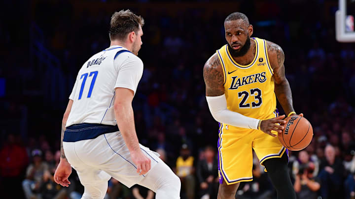 Nov 22, 2023; Los Angeles, California, USA; Los Angeles Lakers forward LeBron James (23) moves the ball against Dallas Mavericks guard Luka Doncic (77) during the second half at Crypto.com Arena. Mandatory Credit: Gary A. Vasquez-Imagn Images Nov 22, 2023; Los Angeles, California, USA; Los Angeles Lakers forward LeBron James (23) moves the ball against Dallas Mavericks guard Luka Doncic (77) during the second half at Crypto.com Arena. Mandatory Credit: Gary A. Vasquez-Imagn Images