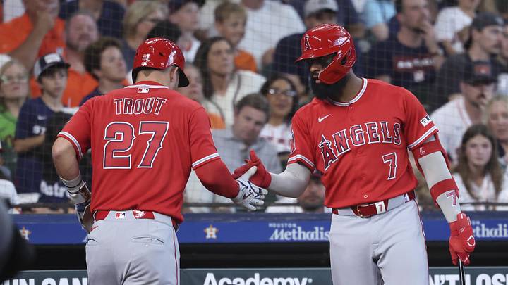 Mar 29, 2026; Houston, Texas, USA; Los Angeles Angels designated hitter Mike Trout (27) celebrates with center fielder Jo Adell (7) after scoring a run during the third inning against the Houston Astros at Daikin Park. Mandatory Credit: Troy Taormina-Imagn Images Mar 29, 2026; Houston, Texas, USA; Los Angeles Angels designated hitter Mike Trout (27) celebrates with center fielder Jo Adell (7) after scoring a run during the third inning against the Houston Astros at Daikin Park. Mandatory Credit: Troy Taormina-Imagn Images