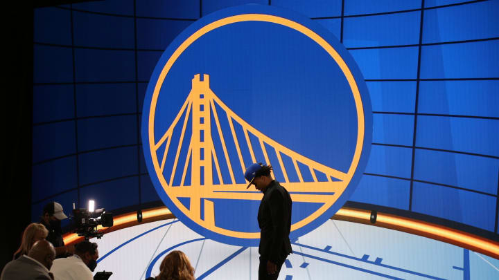 Jul 29, 2021; Brooklyn, New York, USA; Moses Moody (Arkansas) walks off the stage after being selected as the number fourteen overall pick by the Golden State Warriors in the first round of the 2021 NBA Draft at Barclays Center. Mandatory Credit: Brad Penner-USA TODAY Sports