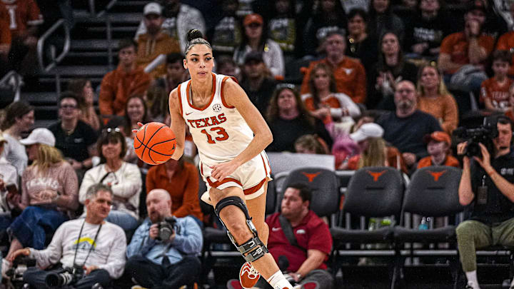Texas Longhorns guard Jordana Codio (13) dribbles the ball towards the Arkansas basket during the game at the Moody Center on Sunday, Jan. 5, 2025. Texas Longhorns guard Jordana Codio (13) dribbles the ball towards the Arkansas basket during the game at the Moody Center on Sunday, Jan. 5, 2025.