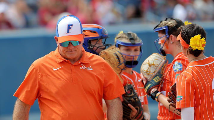Florida head softball coach Tim Walton walks of the field after a time out durinf the Women's College World Series semifinal game between the Oklahoma Sooners and Florida Gators at Devon Park in Oklahoma City, Tuesday, June, 4, 2024.