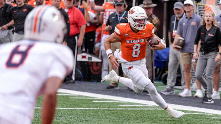 Oklahoma State quarterback Hauss Hejny (8) runs the ball for a touchdown in the first quarter during an NCAA football game between Oklahoma State (OSU) and UT Martin in Stillwater, Okla., on Thursday, Aug. 28, 2025.