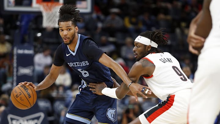 Mar 1, 2024; Memphis, Tennessee, USA; Memphis Grizzlies forward Ziaire Williams (8) dribbles around Portland Trail Blazers forward Jerami Grant (9) during the second half at FedExForum. Mandatory Credit: Petre Thomas-Imagn Images