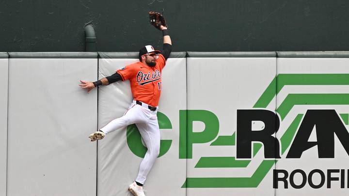 Jun 28, 2026; Baltimore, Maryland, USA;  Baltimore Orioles outfielder Colton Cowser (17) makes a catch at the center field wall in the fifth inning against the Washington Nationals at Oriole Park at Camden Yards. Mandatory Credit: Jamie Sabau-Imagn Images