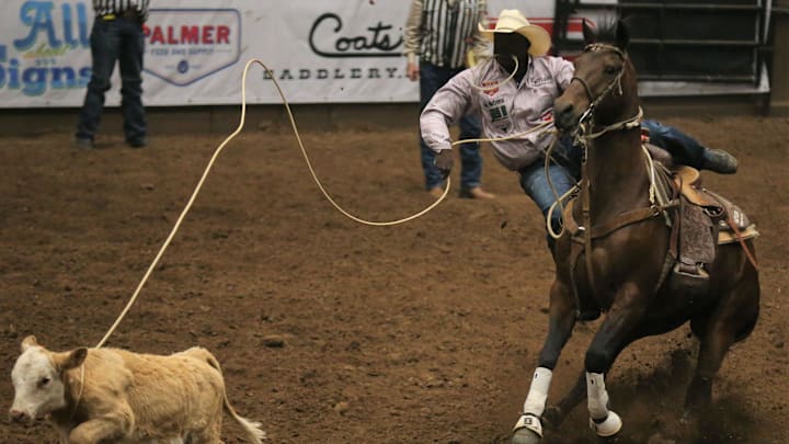 John Douch, of Hunstville, Texas, lassoes his calf and gets ready to jump off his horse in tie-down roping during the fifth performance of the San Angelo Stock Show & Rodeo at Foster Communications Coliseum on Thursday, April 7, 2022.

Rodeo No 5 John Douch