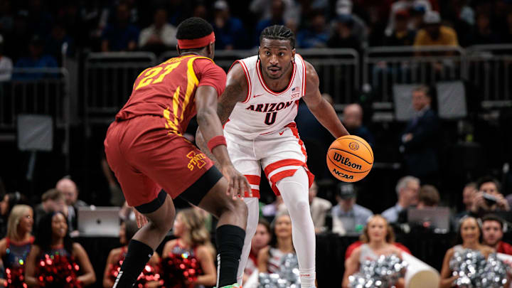 Mar 13, 2026; Kansas City, MO, USA; Arizona Wildcats guard Jaden Bradley (0) brings the ball up court around Iowa State Cyclones guard Killyan Toure (27) during the first half at T-Mobile Center. Mandatory Credit: William Purnell-Imagn Images Mar 13, 2026; Kansas City, MO, USA; Arizona Wildcats guard Jaden Bradley (0) brings the ball up court around Iowa State Cyclones guard Killyan Toure (27) during the first half at T-Mobile Center. Mandatory Credit: William Purnell-Imagn Images