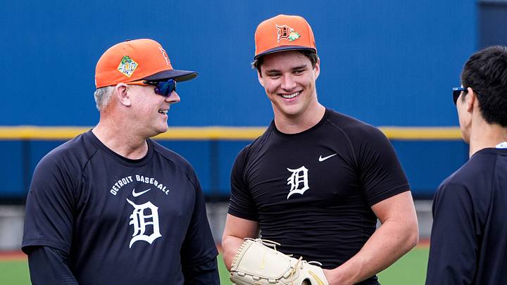 Detroit Tigers manager A.J. Hinch, left, talks to pitcher Jackson Jobe during spring training at TigerTown in Lakeland, Fla. on Monday, Feb. 16, 2026.