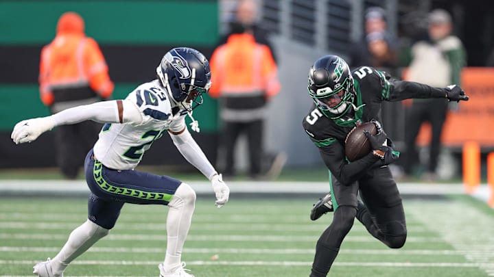 Dec 1, 2024; East Rutherford, New Jersey, USA; New York Jets wide receiver Garrett Wilson (5) fights for yards as Seattle Seahawks cornerback Josh Jobe (29) defends during the second half at MetLife Stadium. Mandatory Credit: Vincent Carchietta-Imagn Images Dec 1, 2024; East Rutherford, New Jersey, USA; New York Jets wide receiver Garrett Wilson (5) fights for yards as Seattle Seahawks cornerback Josh Jobe (29) defends during the second half at MetLife Stadium. Mandatory Credit: Vincent Carchietta-Imagn Images