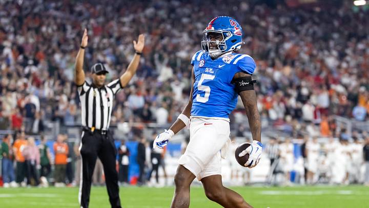 Jan 8, 2026; Glendale, AZ, USA; Mississippi Rebels running back Kewan Lacy (5) runs for a touchdown against the Miami Hurricanes during the 2026 Fiesta Bowl and semifinal game of the College Football Playoff at State Farm Stadium. Mandatory Credit: Mark J. Rebilas-Imagn Images Jan 8, 2026; Glendale, AZ, USA; Mississippi Rebels running back Kewan Lacy (5) runs for a touchdown against the Miami Hurricanes during the 2026 Fiesta Bowl and semifinal game of the College Football Playoff at State Farm Stadium. Mandatory Credit: Mark J. Rebilas-Imagn Images