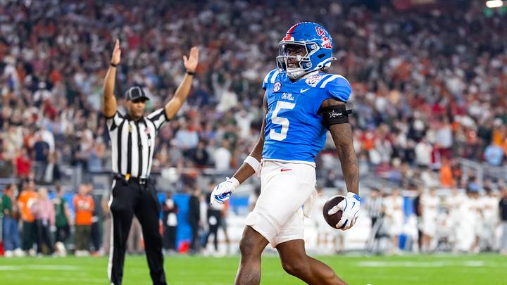 Jan 8, 2026; Glendale, AZ, USA; Mississippi Rebels running back Kewan Lacy (5) runs for a touchdown against the Miami Hurricanes during the 2026 Fiesta Bowl and semifinal game of the College Football Playoff at State Farm Stadium. Mandatory Credit: Mark J. Rebilas-Imagn Images Jan 8, 2026; Glendale, AZ, USA; Mississippi Rebels running back Kewan Lacy (5) runs for a touchdown against the Miami Hurricanes during the 2026 Fiesta Bowl and semifinal game of the College Football Playoff at State Farm Stadium. Mandatory Credit: Mark J. Rebilas-Imagn Images