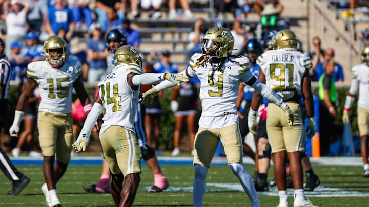 Oct 18, 2025; Durham, North Carolina, USA;  Georgia Tech Yellow Jackets defensive back Jy Gilmore (14) celebrates a play with defensive back Omar Daniels (9) during the second half of the game against Duke Blue Devils at Wallace Wade Stadium. Mandatory Credit: Jaylynn Nash-Imagn Images