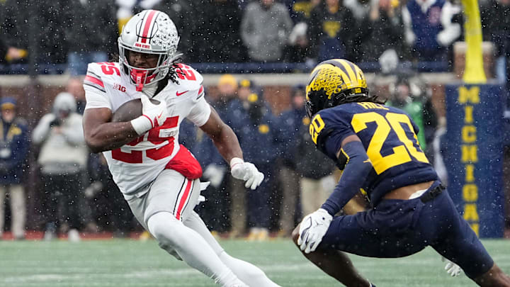 Ohio State Buckeyes running back Bo Jackson (25) runs past Michigan Wolverines defensive back Jyaire Hill (20) during the NCAA football game at Michigan Stadium in Ann Arbor, Mich. on Nov. 29, 2025. Ohio State won 27-9.