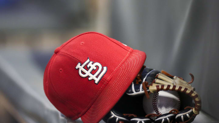 Sep 17, 2018; Atlanta, GA, USA; Detailed view of a St. Louis Cardinals hat and glove in the dugout against the Atlanta Braves in the first inning at SunTrust Park. Mandatory Credit: Brett Davis-Imagn Images
Sep 17, 2018; Atlanta, GA, USA; Detailed view of a St. Louis Cardinals hat and glove in the dugout against the Atlanta Braves in the first inning at SunTrust Park. Mandatory Credit: Brett Davis-Imagn Images