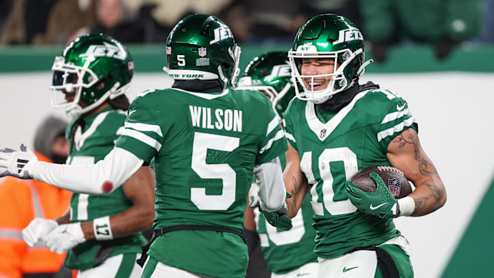 Jan 5, 2025; East Rutherford, New Jersey, USA; New York Jets wide receiver Allen Lazard (10) celebrates his touchdown reception with wide receiver Garrett Wilson (5) during the first half against the Miami Dolphins at MetLife Stadium. Mandatory Credit: Vincent Carchietta-Imagn Images Jan 5, 2025; East Rutherford, New Jersey, USA; New York Jets wide receiver Allen Lazard (10) celebrates his touchdown reception with wide receiver Garrett Wilson (5) during the first half against the Miami Dolphins at MetLife Stadium. Mandatory Credit: Vincent Carchietta-Imagn Images